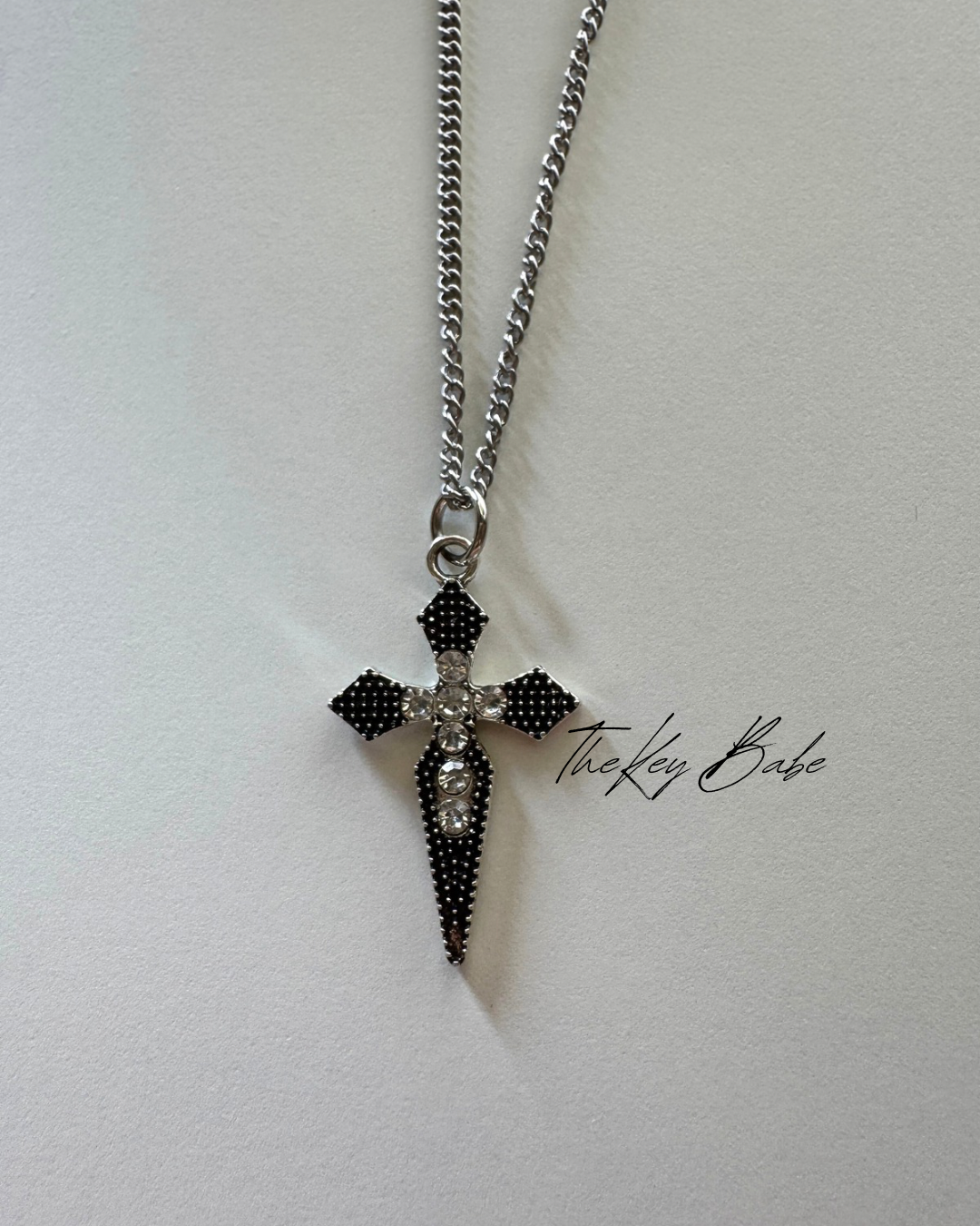 Elegant sharp cross necklace